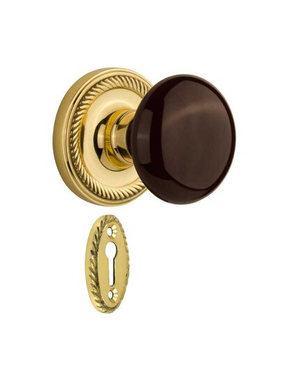 Rope Rosette Mortise-Lock Set with Brown Porcelain Knobs in Polished Brass.